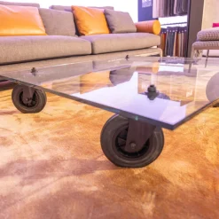 FontanaArte Couchtische|Couchtisch Tavola con Ruota Grande, Design Gea Aulenti 1980, geschliffenes Glas 15 mm, Gestell Rollen schwarz